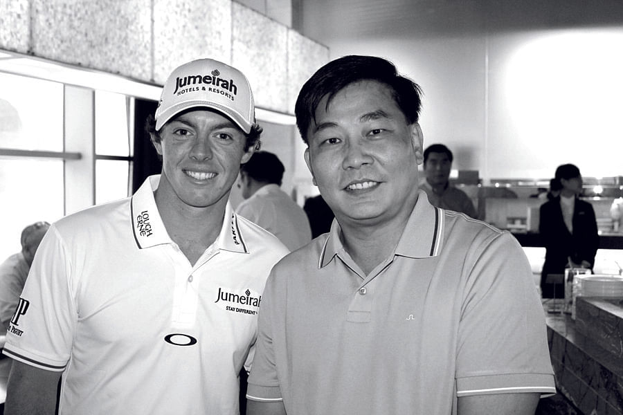 James Lim with golf great Rory McIlroy.