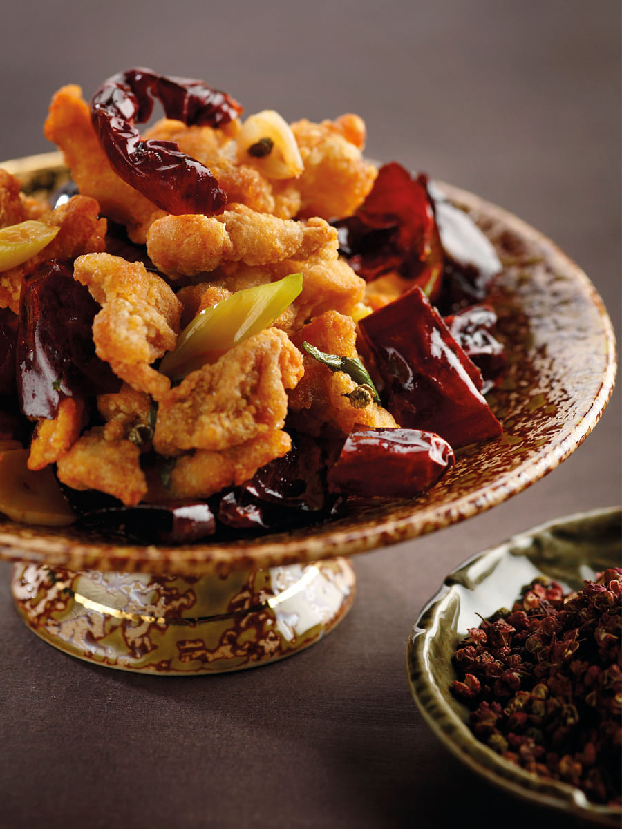 The heat of the kung pao chicken was tempered by sweet flavours.
