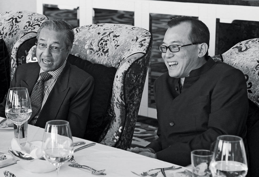 Teo completed high-profile projects for Tun Dr Mahathir Mohamad (seated on left) in the 1990s and early 2000s.