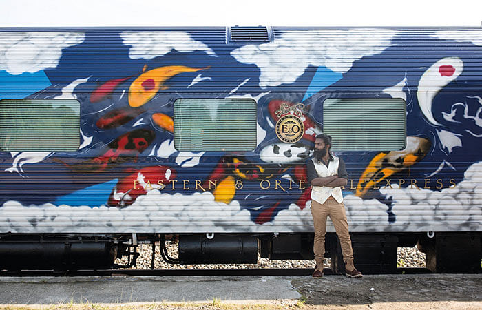 Graffiti artist Rajesh Kumar and the cabin he designed on the Belmond Eastern & Oriental Express