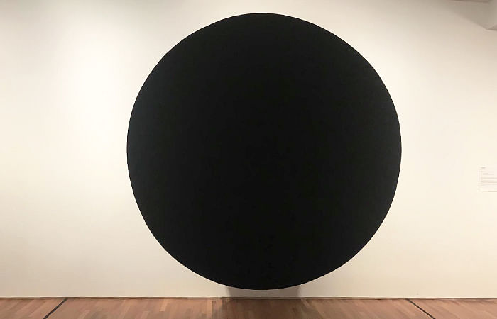 Black hole or void art work by Anish Kapoor at the minimalism exhibition in Singapore.