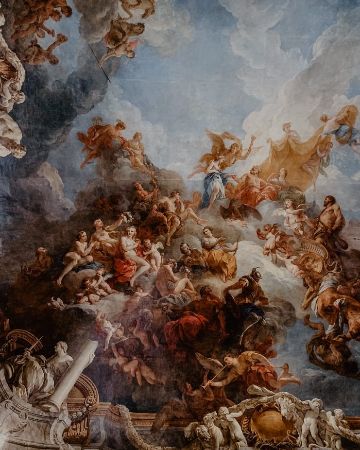 Part of an art mural on the ceiling of the Palace of Versailles, by Adriana Geo on Unsplash