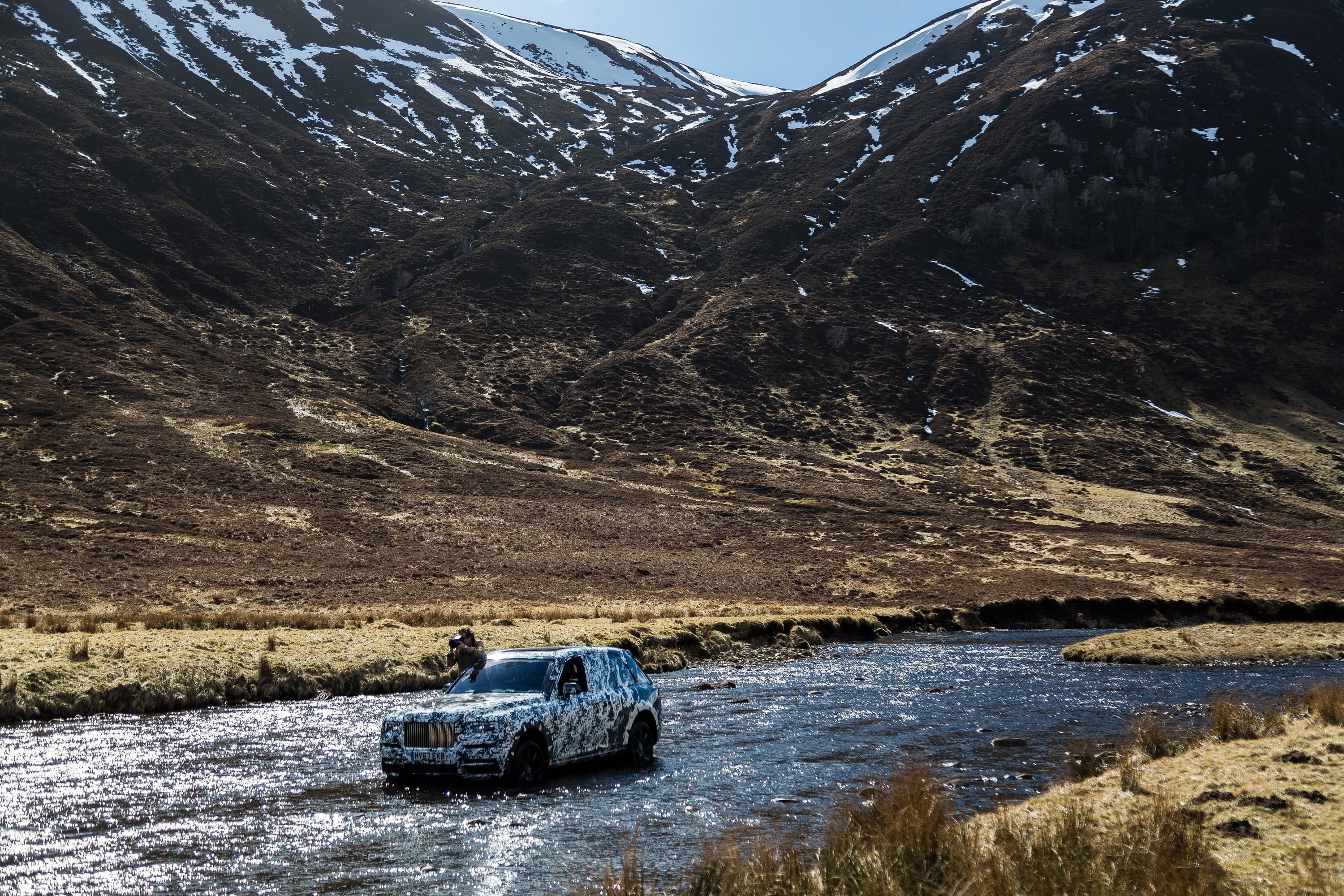 Cory Richards with the Rolls-Royce in the great outdoors.