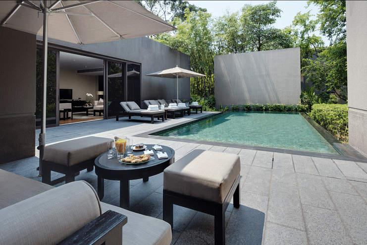 The poolside of Capella Singapore's contemporary manor.