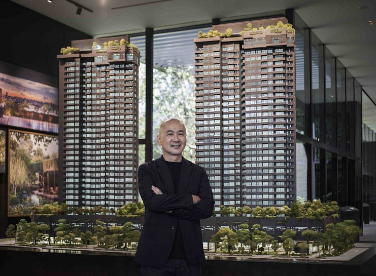 Architect Yip Yuen Hong stands in front of the model of the Midtown Modern condominium.