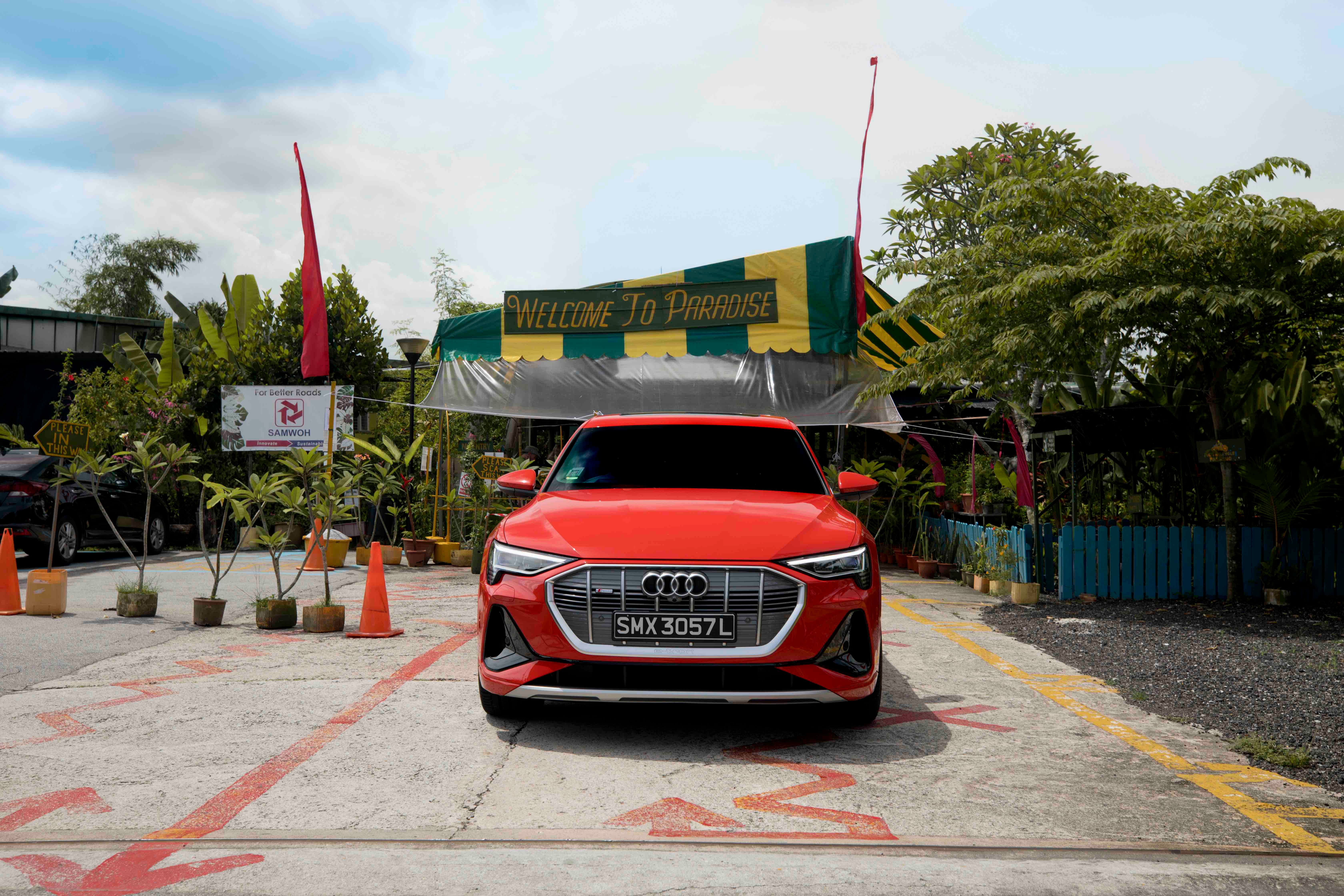 The Audi e-Tron SportBack 50 in front of Paradise on Earth, or Bollywood Veggies.
