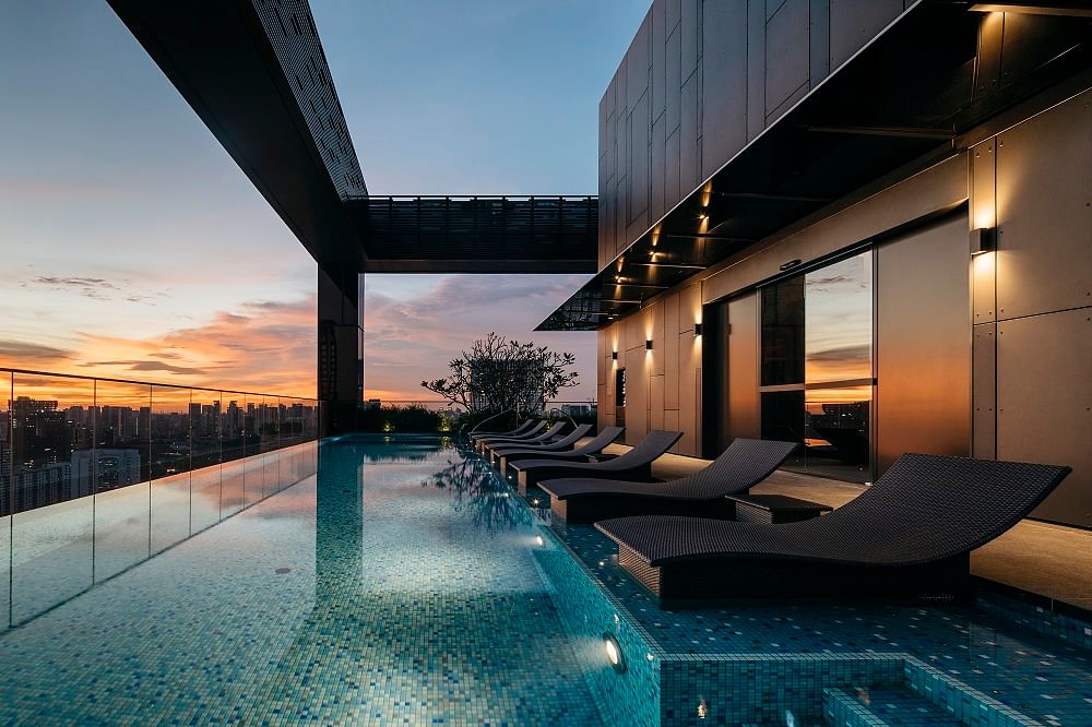 The Clan Hotel Singapore swimming pool in twilight.