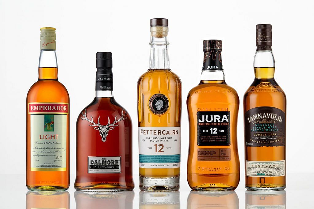 Whyte and Mackay's iconic whiskies alongside the world's best-selling brandy (far left) now form part of the expansive portfolio of Emperador Inc.