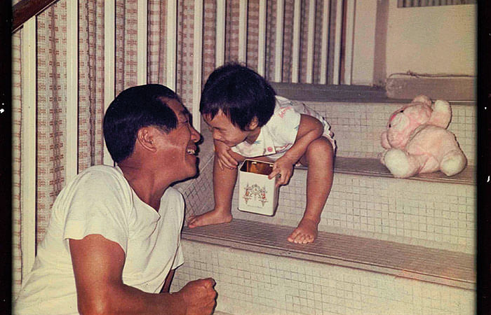Sim Kee Boon, a leading member of the founding generation of civil servants, with his granddaughter