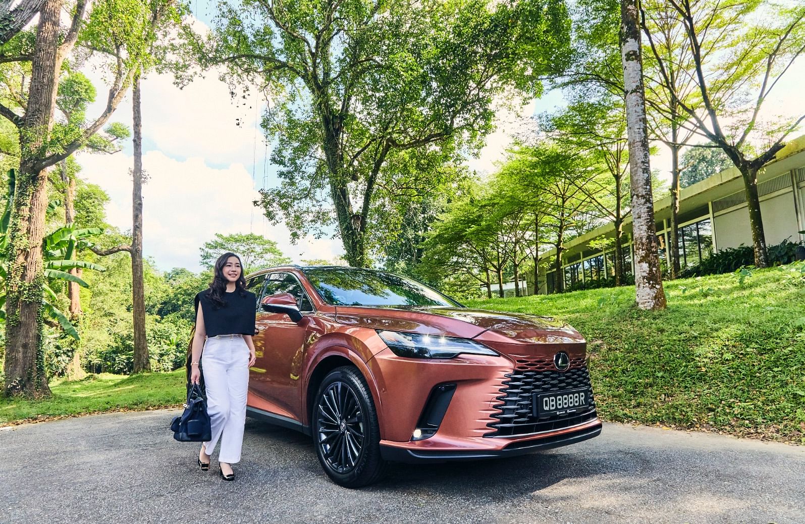 Kara Arissa Tan with the Lexus all-new RX 350h, which pairs a 2.5-litre inline-four engine with a powerful, self-charging electric motor to deliver 247 horsepower with high fuel efficiency of up to 17.8km/L.