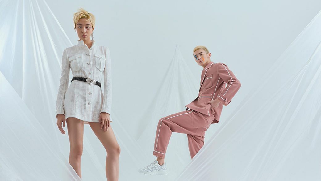 (Left) Polyamide tweed dress, calfskin and crystal belt, and crystal earring, from Chanel. (Right) Cotton jacket, cotton trousers, and technical mesh and rubber sneakers, from Dior.