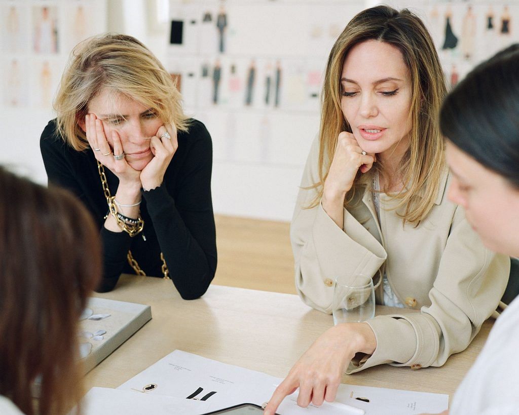 Former Chloe creative director Gabriela Hearst and Atelier Jolie founder Angelina Jolie look at design sketches.