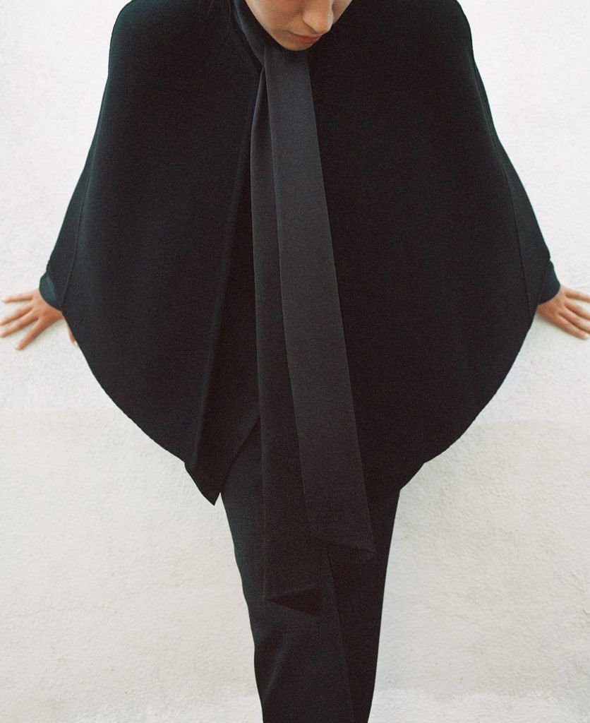 A black velvet opera cape from the Chloe x Atelier Jolie collection.